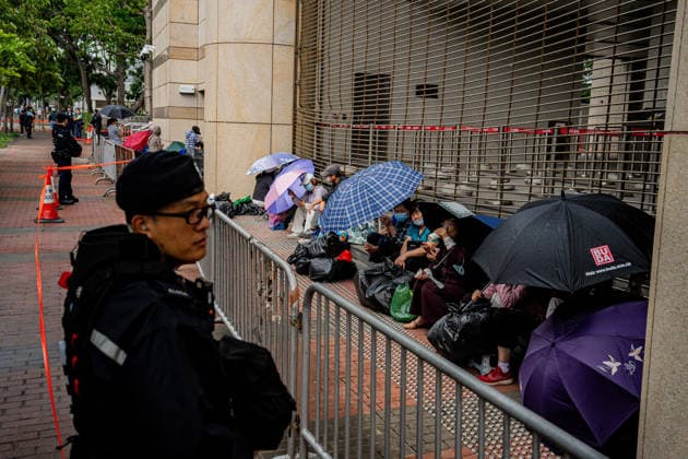 Closing arguments of Tiananmen Square activists trial starts HONG KONG, CHINA - MAY 18: Police officers stand guard outside the West Kowloon Magistrates Court in Hong Kong, China, on May 18, 2026. Closing arguments in the national security case involving the Hong Kong Alliance in Support of Patriotic Democratic Movements of China are scheduled to last three days. Lee Cheuk-yan, 69, and Chow Hang-tung, 41, who organised candlelight vigils to mark Beijing s deadly crackdown on demonstrators in Tiananmen Square in 1989, are standing trial for incitement to subversion , which carries a maximum penalty of 10 years in jail. Harry Leung Anadolu Hong Kong China. Editorial use only. Please get in touch for any other usage. Copyright: x2026xAnadoluxHarryxLeungx