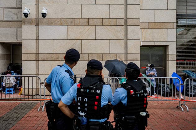 Closing arguments of Tiananmen Square activists trial starts HONG KONG, CHINA - MAY 18: Police officers stand guard outside the West Kowloon Magistrates Court in Hong Kong, China, on May 18, 2026. Closing arguments in the national security case involving the Hong Kong Alliance in Support of Patriotic Democratic Movements of China are scheduled to last three days. Lee Cheuk-yan, 69, and Chow Hang-tung, 41, who organised candlelight vigils to mark Beijing s deadly crackdown on demonstrators in Tiananmen Square in 1989, are standing trial for incitement to subversion , which carries a maximum penalty of 10 years in jail. Harry Leung Anadolu Hong Kong China. Editorial use only. Please get in touch for any other usage. Copyright: x2026xAnadoluxHarryxLeungx