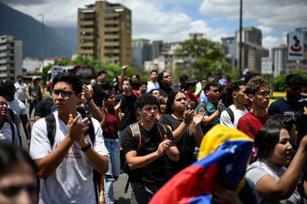 Demonstration in honor of Carmen Navas in Caracas CARACAS, VENEZUELA - MAY 18: Protesters attend a demonstration in honor of Carmen Navas, an 82-year-old mother who died after months of demanding information about her detained son, Victor Quero, who died in state custody in Caracas, Venezuela, May 18, 2026. Maxwell Brienco Anadolu Caracas Venezuela. Editorial use only. Please get in touch for any other usage.  Copyright: x2026xAnadoluxMaxwellxBriencox
