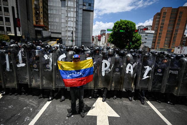 Demonstration in honor of Carmen Navas in Caracas CARACAS, VENEZUELA - MAY 18: Protesters attend a demonstration in honor of Carmen Navas, an 82-year-old mother who died after months of demanding information about her detained son, Victor Quero, who died in state custody in Caracas, Venezuela, May 18, 2026. Maxwell Brienco Anadolu Caracas Venezuela. Editorial use only. Please get in touch for any other usage.  Copyright: x2026xAnadoluxMaxwellxBriencox