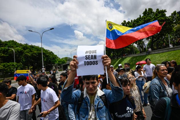 Demonstration in honor of Carmen Navas in Caracas CARACAS, VENEZUELA - MAY 18: Protesters attend a demonstration in honor of Carmen Navas, an 82-year-old mother who died after months of demanding information about her detained son, Victor Quero, who died in state custody in Caracas, Venezuela, May 18, 2026. Maxwell Brienco Anadolu Caracas Venezuela. Editorial use only. Please get in touch for any other usage.  Copyright: x2026xAnadoluxMaxwellxBriencox