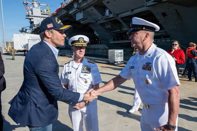 May 18, 2026, Norfolk, Va, United States of America: U.S. Defense Secretary Pete Hegseth, left, shakes hands with Master Chief Petty Officer of the Navy John Perryman, right, as Chief of Naval Operations Adm. Daryl Caudle, center, looks on arrival at the Ford-class super carrier, USS Gerald R. Ford for homecoming celebrations at Naval Station Norfolk, May 16, 2026, in Norfolk, Virginia. The ship returned following a historic 11-month deployment sailing over 57,713 nautical miles. Norfolk United States of America - ZUMAp138 20260518_zaa_p138_043 Copyright: xMc1xJohnxBellino UsxNavyx