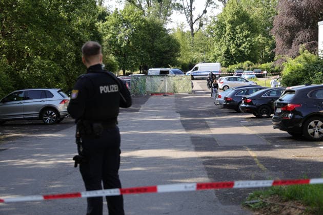 Woman found dead in front of apartment building 23-year-ol