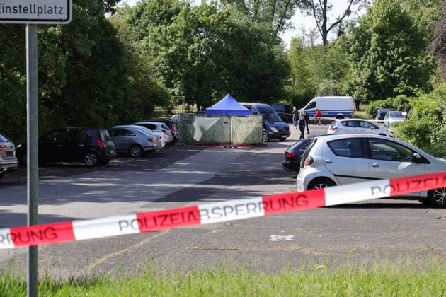 Woman found dead in front of apartment building 23-year-ol