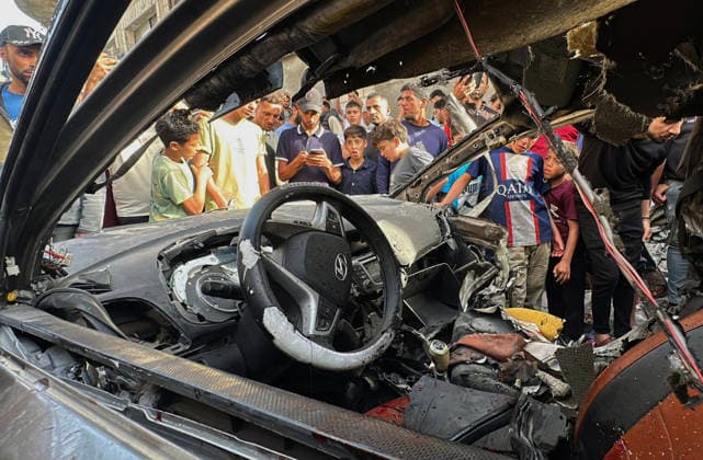 Palestinians Gather at Site of Israeli Strike in Gaza City Palestinians gather at the site of an Israeli airstrike that targeted a vehicle on al-Shuhada Street in Gaza City, on May 19, 2026. According to local sources, the strike killed one person and wounded several others. Photo by Omar Ashtawy apaimages Gaza city Gaza Strip Palestinian Territory 190526_Gaza_OSH_00(2) Copyright: xapaimagesxOmarxAshtawyx xapaimagesx