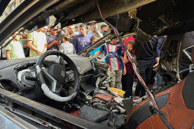 Palestinians Gather at Site of Israeli Strike in Gaza City Palestinians gather at the site of an Israeli airstrike that targeted a vehicle on al-Shuhada Street in Gaza City, on May 19, 2026. According to local sources, the strike killed one person and wounded several others. Photo by Omar Ashtawy apaimages Gaza city Gaza Strip Palestinian Territory 190526_Gaza_OSH_00(3) Copyright: xapaimagesxOmarxAshtawyx xapaimagesx