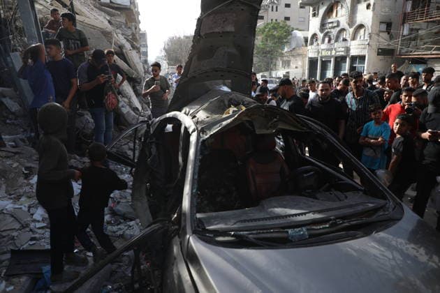 Palestinians Gather at Site of Israeli Strike in Gaza City Palestinians gather at the site of an Israeli airstrike that targeted a vehicle on al-Shuhada Street in Gaza City, on May 19, 2026. According to local sources, the strike killed one person and wounded several others. Photo by Omar Ashtawy apaimages Gaza city Gaza Strip Palestinian Territory 190526_Gaza_OSH_01(8) Copyright: xapaimagesxOmarxAshtawyx xapaimagesx