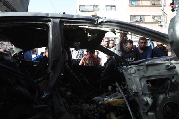 Palestinians Gather at Site of Israeli Strike in Gaza City Palestinians gather at the site of an Israeli airstrike that targeted a vehicle on al-Shuhada Street in Gaza City, on May 19, 2026. According to local sources, the strike killed one person and wounded several others. Photo by Omar Ashtawy apaimages Gaza city Gaza Strip Palestinian Territory 190526_Gaza_OSH_01(13) Copyright: xapaimagesxOmarxAshtawyx xapaimagesx