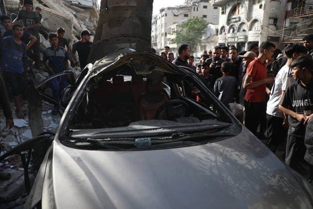 Palestinians Gather at Site of Israeli Strike in Gaza City Palestinians gather at the site of an Israeli airstrike that targeted a vehicle on al-Shuhada Street in Gaza City, on May 19, 2026. According to local sources, the strike killed one person and wounded several others. Photo by Omar Ashtawy apaimages Gaza city Gaza Strip Palestinian Territory 190526_Gaza_OSH_01(6) Copyright: xapaimagesxOmarxAshtawyx xapaimagesx