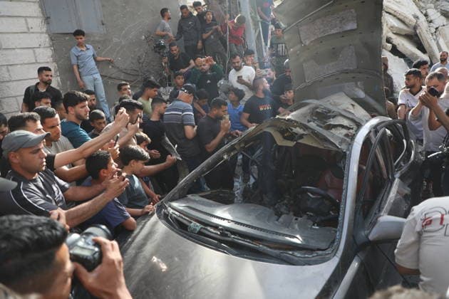Palestinians Gather at Site of Israeli Strike in Gaza City Palestinians gather at the site of an Israeli airstrike that targeted a vehicle on al-Shuhada Street in Gaza City, on May 19, 2026. According to local sources, the strike killed one person and wounded several others. Photo by Omar Ashtawy apaimages Gaza city Gaza Strip Palestinian Territory 190526_Gaza_OSH_01(1) Copyright: xapaimagesxOmarxAshtawyx xapaimagesx
