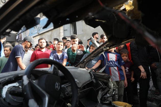Palestinians Gather at Site of Israeli Strike in Gaza City Palestinians gather at the site of an Israeli airstrike that targeted a vehicle on al-Shuhada Street in Gaza City, on May 19, 2026. According to local sources, the strike killed one person and wounded several others. Photo by Omar Ashtawy apaimages Gaza city Gaza Strip Palestinian Territory 190526_Gaza_OSH_01(3) Copyright: xapaimagesxOmarxAshtawyx xapaimagesx