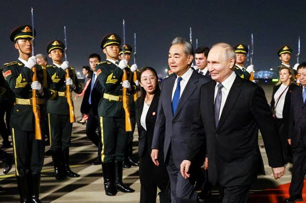 CHINA, BEIJING - MAY 19, 2026: Russia s President Vladimir Putin (R front) and China s Minister of Foreign Affairs Wang Yi (2nd R front) during a ceremony marking Putin s arrival at the Beijing Capital International Airport (Shoudu). Russian President Putin s official visit to China coincides with the 25th anniversary of the Treaty of Good-Neighbourliness and Friendly Cooperation Between the People s Republic of China and the Russian Federation, which was signed on 16 July, 2001. Vladimir Smirnov TASS  92744689