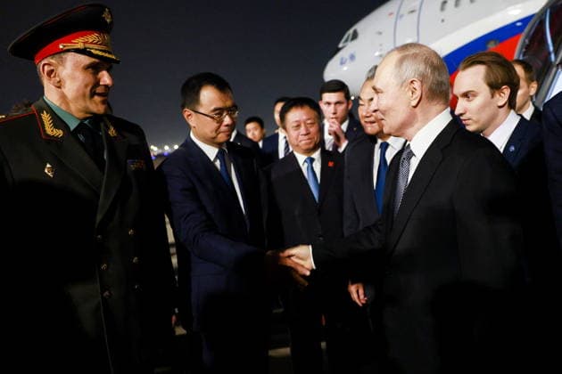 CHINA, BEIJING - MAY 19, 2026: Russia s President Vladimir Putin (2nd R) and China s Minister of Foreign Affairs Wang Yi (3rd R) during a ceremony marking Putin s arrival at Beijing Capital International Airport (Shoudu). Russian President Putin s official visit to China coincides with the 25th anniversary of the Treaty of Good-Neighbourliness and Friendly Cooperation Between the People s Republic of China and the Russian Federation, which was signed on 16 July, 2001. Vladimir Smirnov TASS  92744759