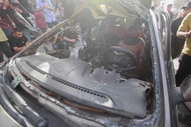 RECORD DATE NOT STATED Palestinians Inspect Damaged Vehicle After Drone Strike in Gaza City (INT) Palestinians Inspect Damaged Vehicle After Drone Strike in Gaza City. May 18, 2026, Gaza, Palestine: Palestinians inspect a civilian vehicle after it was struck by a missile fired from an Israeli drone in the Al-Rimal neighborhood in central Gaza City. Medical sources said the strike killed one person and wounded at least four others, as emergency teams transferred the casualties to nearby hospitals for treatment. Credit: Hashem Zimmo Thenews2(Foto: Hashem Zimmo Thenews2 imago images) Palestinians Inspect Damaged Vehicle After Drone Strike in Gaza City  Copyright: xHashemxZimmox