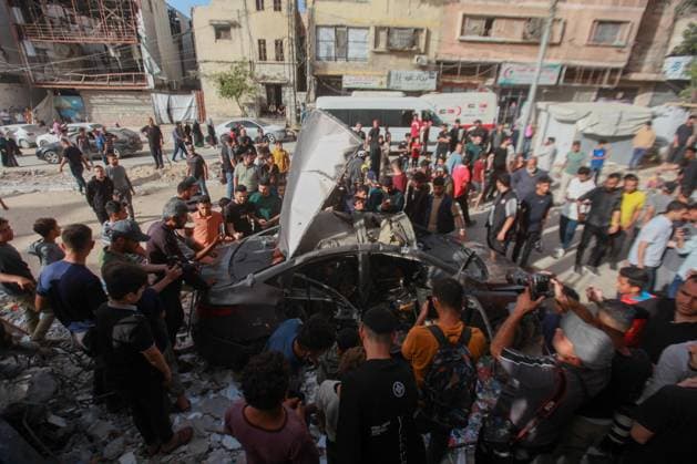 RECORD DATE NOT STATED Palestinians Inspect Damaged Vehicle After Drone Strike in Gaza City (INT) Palestinians Inspect Damaged Vehicle After Drone Strike in Gaza City. May 18, 2026, Gaza, Palestine: Palestinians inspect a civilian vehicle after it was struck by a missile fired from an Israeli drone in the Al-Rimal neighborhood in central Gaza City. Medical sources said the strike killed one person and wounded at least four others, as emergency teams transferred the casualties to nearby hospitals for treatment. Credit: Hashem Zimmo Thenews2(Foto: Hashem Zimmo Thenews2 imago images) Palestinians Inspect Damaged Vehicle After Drone Strike in Gaza City  Copyright: xHashemxZimmox