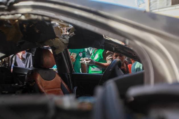RECORD DATE NOT STATED Palestinians Inspect Damaged Vehicle After Drone Strike in Gaza City (INT) Palestinians Inspect Damaged Vehicle After Drone Strike in Gaza City. May 18, 2026, Gaza, Palestine: Palestinians inspect a civilian vehicle after it was struck by a missile fired from an Israeli drone in the Al-Rimal neighborhood in central Gaza City. Medical sources said the strike killed one person and wounded at least four others, as emergency teams transferred the casualties to nearby hospitals for treatment. Credit: Hashem Zimmo Thenews2(Foto: Hashem Zimmo Thenews2 imago images) Palestinians Inspect Damaged Vehicle After Drone Strike in Gaza City  Copyright: xHashemxZimmox