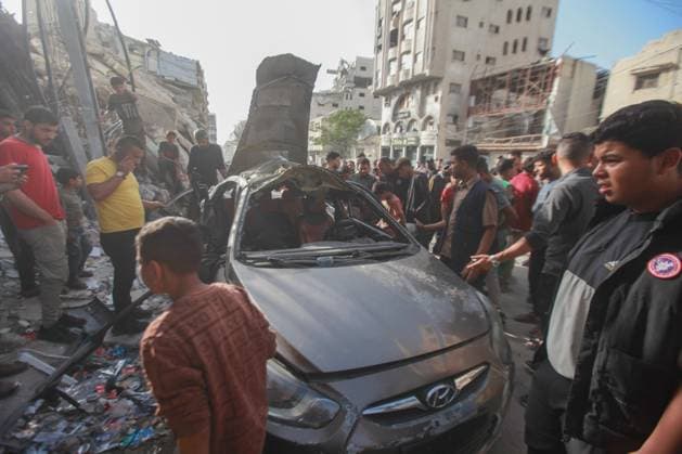 RECORD DATE NOT STATED Palestinians Inspect Damaged Vehicle After Drone Strike in Gaza City (INT) Palestinians Inspect Damaged Vehicle After Drone Strike in Gaza City. May 18, 2026, Gaza, Palestine: Palestinians inspect a civilian vehicle after it was struck by a missile fired from an Israeli drone in the Al-Rimal neighborhood in central Gaza City. Medical sources said the strike killed one person and wounded at least four others, as emergency teams transferred the casualties to nearby hospitals for treatment. Credit: Hashem Zimmo Thenews2(Foto: Hashem Zimmo Thenews2 imago images) Palestinians Inspect Damaged Vehicle After Drone Strike in Gaza City  Copyright: xHashemxZimmox