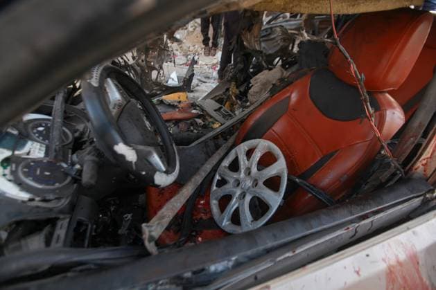RECORD DATE NOT STATED Palestinians Inspect Damaged Vehicle After Drone Strike in Gaza City (INT) Palestinians Inspect Damaged Vehicle After Drone Strike in Gaza City. May 18, 2026, Gaza, Palestine: Palestinians inspect a civilian vehicle after it was struck by a missile fired from an Israeli drone in the Al-Rimal neighborhood in central Gaza City. Medical sources said the strike killed one person and wounded at least four others, as emergency teams transferred the casualties to nearby hospitals for treatment. Credit: Hashem Zimmo Thenews2(Foto: Hashem Zimmo Thenews2 imago images) Palestinians Inspect Damaged Vehicle After Drone Strike in Gaza City  Copyright: xHashemxZimmox