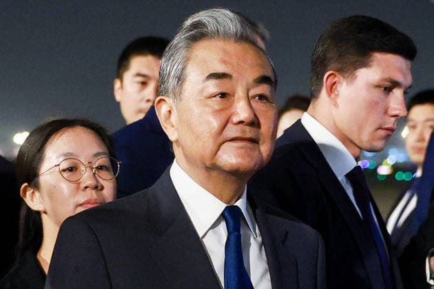 CHINA, BEIJING - MAY 19, 2026: China s Minister of Foreign Affairs Wang Yi (C) during a ceremony marking the arrival of and Russia s President Putin (not pictured) at Beijing Capital International Airport (Shoudu). Russian President Putin s official visit to China coincides with the 25th anniversary of the Treaty of Good-Neighbourliness and Friendly Cooperation Between the People s Republic of China and the Russian Federation, which was signed on 16 July, 2001. Vladimir Smirnov TASS  92744826