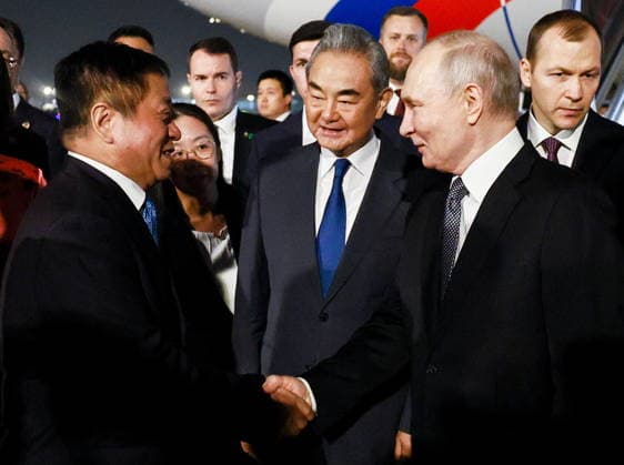 CHINA, BEIJING - MAY 19, 2026: China s Minister of Foreign Affairs Wang Yi (C) and Russia s President Vladimir Putin (R front) during a ceremony marking Putin s arrival at Beijing Capital International Airport (Shoudu). Russian President Putin s official visit to China coincides with the 25th anniversary of the Treaty of Good-Neighbourliness and Friendly Cooperation Between the People s Republic of China and the Russian Federation, which was signed on 16 July, 2001. Vladimir Smirnov TASS  92744889