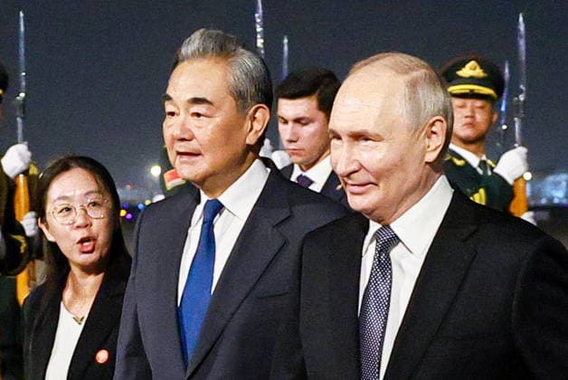 CHINA, BEIJING - MAY 19, 2026: China s Minister of Foreign Affairs Wang Yi (L front) and Russia s President Vladimir Putin (R front) during a ceremony marking Putin s arrival at Beijing Capital International Airport (Shoudu). Russian President Putin s official visit to China coincides with the 25th anniversary of the Treaty of Good-Neighbourliness and Friendly Cooperation Between the People s Republic of China and the Russian Federation, which was signed on 16 July, 2001. Vladimir Smirnov TASS  92745126