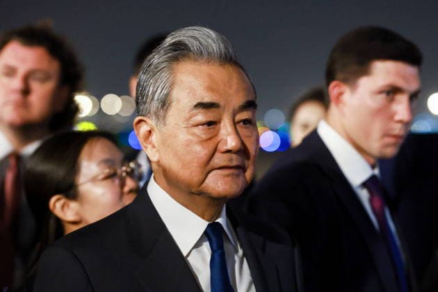CHINA, BEIJING - MAY 19, 2026: China s Minister of Foreign Affairs Wang Yi (C) during a ceremony marking the arrival of and Russia s President Putin (not pictured) at Beijing Capital International Airport (Shoudu). Russian President Putin s official visit to China coincides with the 25th anniversary of the Treaty of Good-Neighbourliness and Friendly Cooperation Between the People s Republic of China and the Russian Federation, which was signed on 16 July, 2001. Vladimir Smirnov TASS  92745064