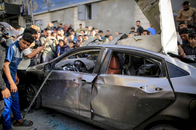 Israeli army targets vehicle in Gaza Strip GAZA CITY, GAZA, PALESTINE - MAY 19: Palestinians inspect a damaged vehicle after an Israeli army strike in the al-Rimal neighborhood of Gaza City, Gaza Strip, Palestine on May 19, 2026. According to reports, one person was killed and four others were injured in the attack targeting the vehicle. Saeed M. M. T. Jaras Anadolu Gaza Palestine. Editorial use only. Please get in touch for any other usage.  Copyright: x2026xAnadoluxSaeedxM.xM.xT.xJarasx