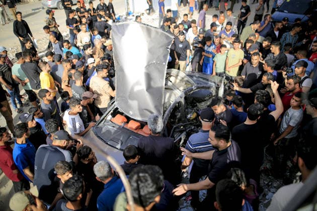 Israeli army targets vehicle in Gaza Strip GAZA CITY, GAZA, PALESTINE - MAY 19: Palestinians inspect a damaged vehicle after an Israeli army strike in the al-Rimal neighborhood of Gaza City, Gaza Strip, Palestine on May 19, 2026. According to reports, one person was killed and four others were injured in the attack targeting the vehicle. Saeed M. M. T. Jaras Anadolu Gaza Palestine. Editorial use only. Please get in touch for any other usage.  Copyright: x2026xAnadoluxSaeedxM.xM.xT.xJarasx