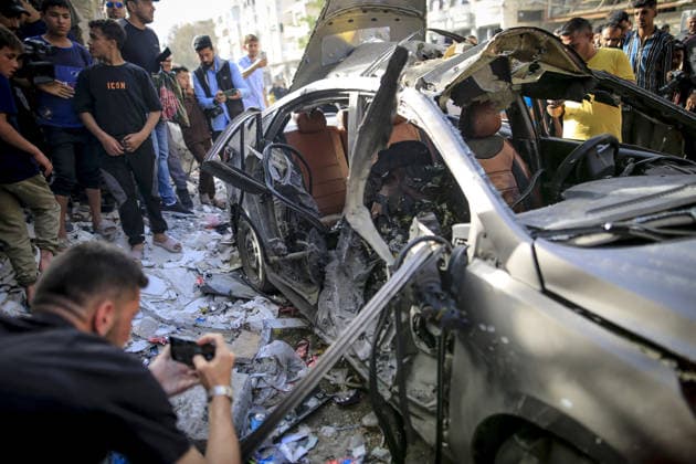 Israeli army targets vehicle in Gaza Strip GAZA CITY, GAZA, PALESTINE - MAY 19: Palestinians inspect a damaged vehicle after an Israeli army strike in the al-Rimal neighborhood of Gaza City, Gaza Strip, Palestine on May 19, 2026. According to reports, one person was killed and four others were injured in the attack targeting the vehicle. Saeed M. M. T. Jaras Anadolu Gaza Palestine. Editorial use only. Please get in touch for any other usage.  Copyright: x2026xAnadoluxSaeedxM.xM.xT.xJarasx