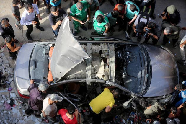 Israeli army targets vehicle in Gaza Strip GAZA CITY, GAZA, PALESTINE - MAY 19: Palestinians inspect a damaged vehicle after an Israeli army strike in the al-Rimal neighborhood of Gaza City, Gaza Strip, Palestine on May 19, 2026. According to reports, one person was killed and four others were injured in the attack targeting the vehicle. Saeed M. M. T. Jaras Anadolu Gaza Palestine. Editorial use only. Please get in touch for any other usage.  Copyright: x2026xAnadoluxSaeedxM.xM.xT.xJarasx