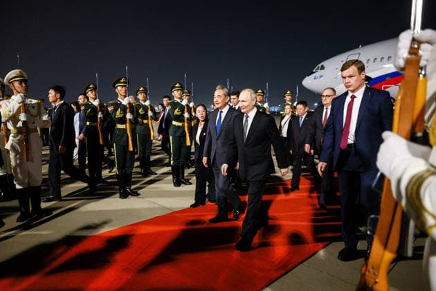 CHINA, BEIJING - MAY 19, 2026: China s Minister of Foreign Affairs Wang Yi and Russia s President Vladimir Putin (L-R centre front) during a ceremony marking Putin s arrival at Beijing Capital International Airport (Shoudu). Russian President Putin s official visit to China coincides with the 25th anniversary of the Treaty of Good-Neighbourliness and Friendly Cooperation Between the People s Republic of China and the Russian Federation, which was signed on 16 July, 2001 Beijing China  - ZUMAt113 20260519_zaa_t113_538 Copyright: xVladimirxSmirnovx
