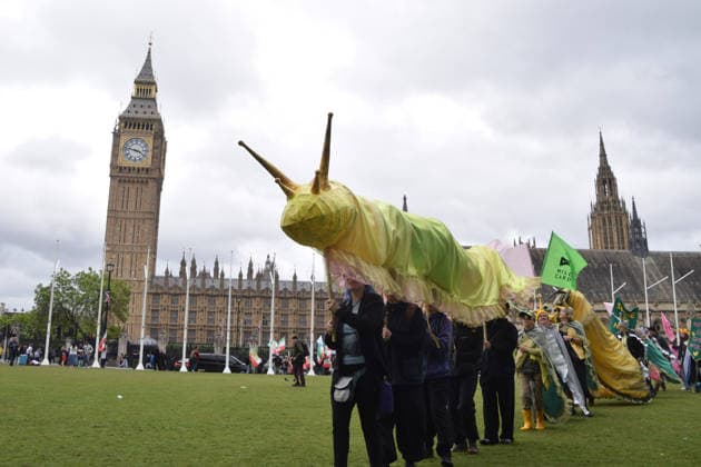 May 19, 2026, London, England, United Kingdom: Activists hold a large model slug in Parliament Square during the march for ancient woodland restoration. Organised by the campaign group Wild Card, the protesters marched to the Department for Environment, Food and Rural Affairs (DEFRA) calling on the government to restore so-called ghost woods , remains of ancient ecosystems buried beneath timber plantations. London United Kingdom - ZUMAv130 20260519_zip_v130_069 Copyright: xVukxValcicx