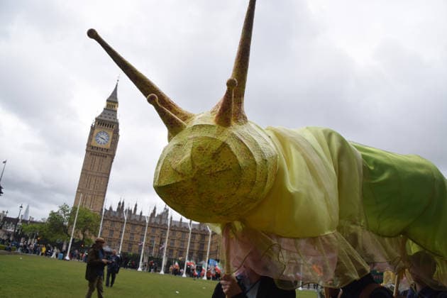 May 19, 2026, London, England, United Kingdom: Activists hold a large model slug in Parliament Square during the march for ancient woodland restoration. Organised by the campaign group Wild Card, the protesters marched to the Department for Environment, Food and Rural Affairs (DEFRA) calling on the government to restore so-called ghost woods , remains of ancient ecosystems buried beneath timber plantations. London United Kingdom - ZUMAv130 20260519_zip_v130_090 Copyright: xVukxValcicx
