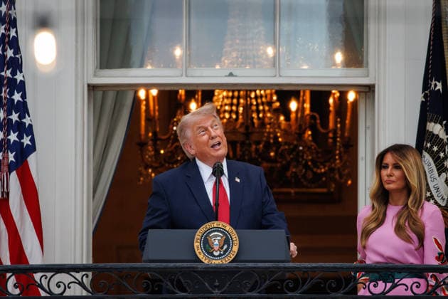 U.S. President Donald Trump speaks alongside First Lady Melania Trump during the Congressional Picnic on the South Lawn of the White House on May 19, 2026 in Washington, DC.  WAX20260519841 SamuelxCorum