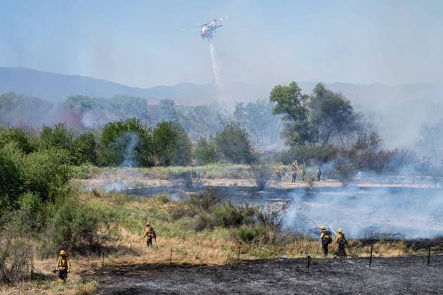 Bain Fire erupts in Jurupa Valley burns over 600 acres CALIFORNIA, US - MAY 19: San Bernadino County Firefighters seen during the Bain Fire originating from Jurupa Valley, California, United States on May 19, 2026. Jon Putman Anadolu California United States. Editorial use only. Please get in touch for any other usage.  Copyright: x2026xAnadoluxJonxPutmanx
