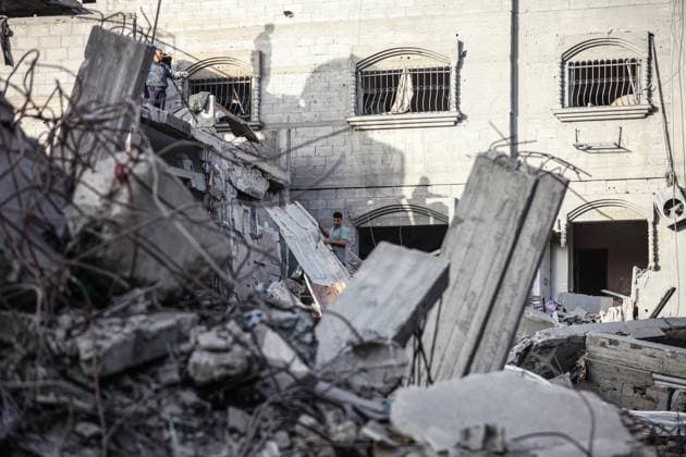 Israeli army targets building in the Bureij camp in Gaza BUREIJ, GAZA, PALESTINE - MAY 20: Palestinians inspect the destruction of a residential building belonging to the Abu Shamala family following an Israeli air strike at the Bureij camp in the central Gaza Strip, Palestine on May 20, 2026. The targeted attack completely flattened the multi-story structure and caused extensive structural damage to numerous neighboring homes. Moiz Salhi Anadolu Bureij Gaza. Editorial use only. Please get in touch for any other usage.  Copyright: x2026xAnadoluxMoizxSalhix