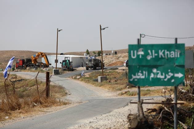 Illegal Israeli settlers expand outpost in West Bank s Umm al-Khair HEBRON, WEST BANK, PALESTINE - MAY 20: Prefabricated houses installed by illegal Israeli settlers are seen under the protection of the Israeli army in the village of Umm al-Khair, located in the Masafer Yatta region south of Hebron in West Bank, Palestine on May 20, 2026. Illegal settlers continue to expand a newly established settlement outpost, seizing Palestinian lands in the area. Wisam Hashlamoun Anadolu Hebron West Bank. Editorial use only. Please get in touch for any other usage.  Copyright: x2026xAnadoluxWisamxHashlamounx