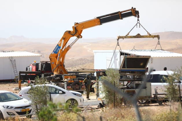 Illegal Israeli settlers expand outpost in West Bank s Umm al-Khair HEBRON, WEST BANK, PALESTINE - MAY 20: Prefabricated houses installed by illegal Israeli settlers are seen under the protection of the Israeli army in the village of Umm al-Khair, located in the Masafer Yatta region south of Hebron in West Bank, Palestine on May 20, 2026. Illegal settlers continue to expand a newly established settlement outpost, seizing Palestinian lands in the area. Wisam Hashlamoun Anadolu Hebron West Bank. Editorial use only. Please get in touch for any other usage.  Copyright: x2026xAnadoluxWisamxHashlamounx