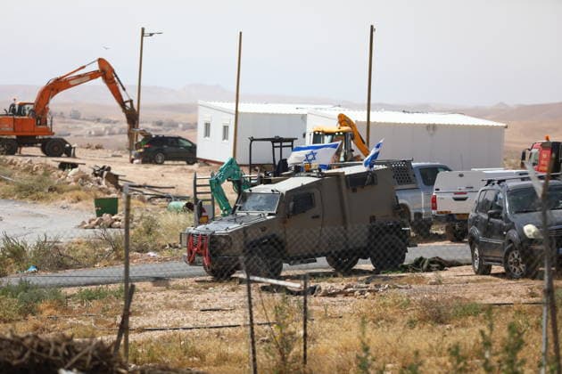 Illegal Israeli settlers expand outpost in West Bank s Umm al-Khair HEBRON, WEST BANK, PALESTINE - MAY 20: Prefabricated houses installed by illegal Israeli settlers are seen under the protection of the Israeli army in the village of Umm al-Khair, located in the Masafer Yatta region south of Hebron in West Bank, Palestine on May 20, 2026. Illegal settlers continue to expand a newly established settlement outpost, seizing Palestinian lands in the area. Wisam Hashlamoun Anadolu Hebron West Bank. Editorial use only. Please get in touch for any other usage.  Copyright: x2026xAnadoluxWisamxHashlamounx