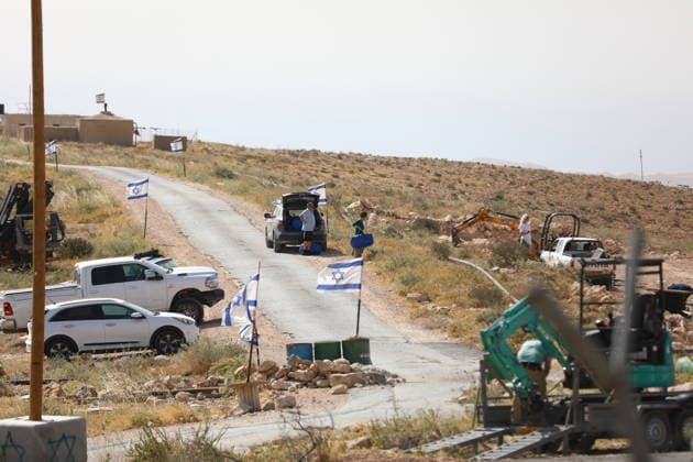 Illegal Israeli settlers expand outpost in West Bank s Umm al-Khair HEBRON, WEST BANK, PALESTINE - MAY 20: Prefabricated houses installed by illegal Israeli settlers are seen under the protection of the Israeli army in the village of Umm al-Khair, located in the Masafer Yatta region south of Hebron in West Bank, Palestine on May 20, 2026. Illegal settlers continue to expand a newly established settlement outpost, seizing Palestinian lands in the area. Wisam Hashlamoun Anadolu Hebron West Bank. Editorial use only. Please get in touch for any other usage.  Copyright: x2026xAnadoluxWisamxHashlamounx