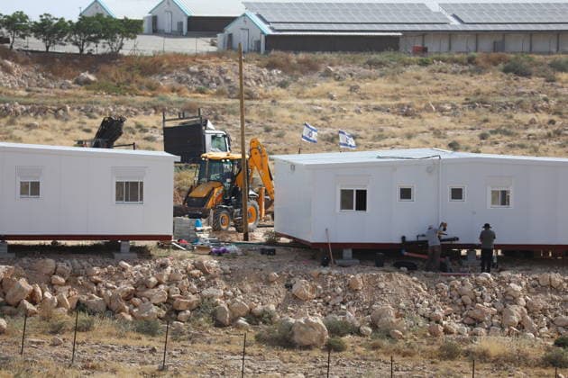 Illegal Israeli settlers expand outpost in West Bank s Umm al-Khair HEBRON, WEST BANK, PALESTINE - MAY 20: Prefabricated houses installed by illegal Israeli settlers are seen under the protection of the Israeli army in the village of Umm al-Khair, located in the Masafer Yatta region south of Hebron in West Bank, Palestine on May 20, 2026. Illegal settlers continue to expand a newly established settlement outpost, seizing Palestinian lands in the area. Wisam Hashlamoun Anadolu Hebron West Bank. Editorial use only. Please get in touch for any other usage.  Copyright: x2026xAnadoluxWisamxHashlamounx