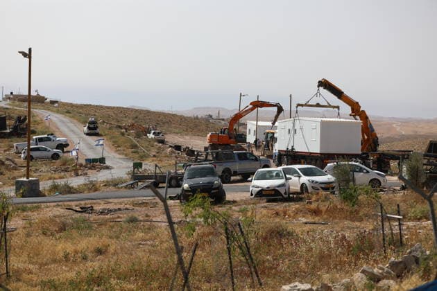 Illegal Israeli settlers expand outpost in West Bank s Umm al-Khair HEBRON, WEST BANK, PALESTINE - MAY 20: Prefabricated houses installed by illegal Israeli settlers are seen under the protection of the Israeli army in the village of Umm al-Khair, located in the Masafer Yatta region south of Hebron in West Bank, Palestine on May 20, 2026. Illegal settlers continue to expand a newly established settlement outpost, seizing Palestinian lands in the area. Wisam Hashlamoun Anadolu Hebron West Bank. Editorial use only. Please get in touch for any other usage.  Copyright: x2026xAnadoluxWisamxHashlamounx