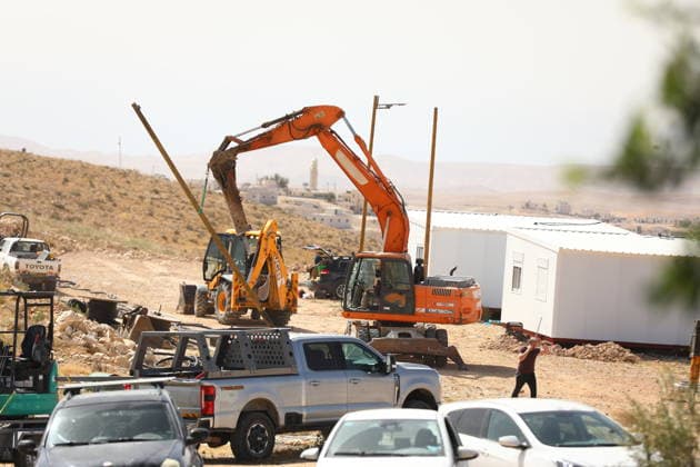 Illegal Israeli settlers expand outpost in West Bank s Umm al-Khair HEBRON, WEST BANK, PALESTINE - MAY 20: Prefabricated houses installed by illegal Israeli settlers are seen under the protection of the Israeli army in the village of Umm al-Khair, located in the Masafer Yatta region south of Hebron in West Bank, Palestine on May 20, 2026. Illegal settlers continue to expand a newly established settlement outpost, seizing Palestinian lands in the area. Wisam Hashlamoun Anadolu Hebron West Bank. Editorial use only. Please get in touch for any other usage.  Copyright: x2026xAnadoluxWisamxHashlamounx