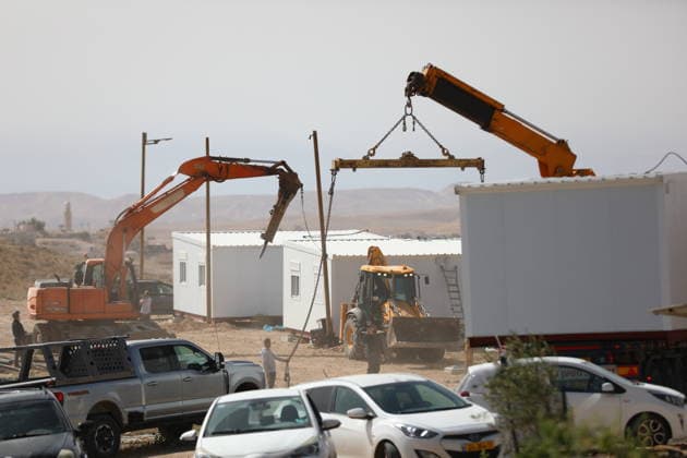 Illegal Israeli settlers expand outpost in West Bank s Umm al-Khair HEBRON, WEST BANK, PALESTINE - MAY 20: Prefabricated houses installed by illegal Israeli settlers are seen under the protection of the Israeli army in the village of Umm al-Khair, located in the Masafer Yatta region south of Hebron in West Bank, Palestine on May 20, 2026. Illegal settlers continue to expand a newly established settlement outpost, seizing Palestinian lands in the area. Wisam Hashlamoun Anadolu Hebron West Bank. Editorial use only. Please get in touch for any other usage.  Copyright: x2026xAnadoluxWisamxHashlamounx