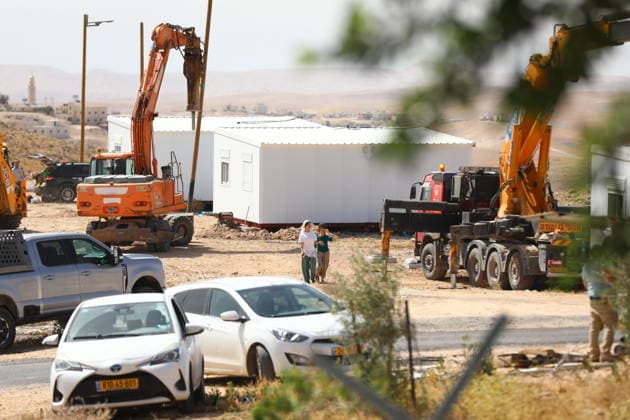 Illegal Israeli settlers expand outpost in West Bank s Umm al-Khair HEBRON, WEST BANK, PALESTINE - MAY 20: Prefabricated houses installed by illegal Israeli settlers are seen under the protection of the Israeli army in the village of Umm al-Khair, located in the Masafer Yatta region south of Hebron in West Bank, Palestine on May 20, 2026. Illegal settlers continue to expand a newly established settlement outpost, seizing Palestinian lands in the area. Wisam Hashlamoun Anadolu Hebron West Bank. Editorial use only. Please get in touch for any other usage.  Copyright: x2026xAnadoluxWisamxHashlamounx