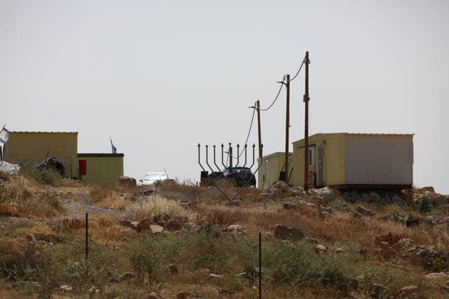Illegal Israeli settlers expand outpost in West Bank s Umm al-Khair HEBRON, WEST BANK, PALESTINE - MAY 20: Prefabricated houses installed by illegal Israeli settlers are seen under the protection of the Israeli army in the village of Umm al-Khair, located in the Masafer Yatta region south of Hebron in West Bank, Palestine on May 20, 2026. Illegal settlers continue to expand a newly established settlement outpost, seizing Palestinian lands in the area. Wisam Hashlamoun Anadolu Hebron West Bank. Editorial use only. Please get in touch for any other usage.  Copyright: x2026xAnadoluxWisamxHashlamounx