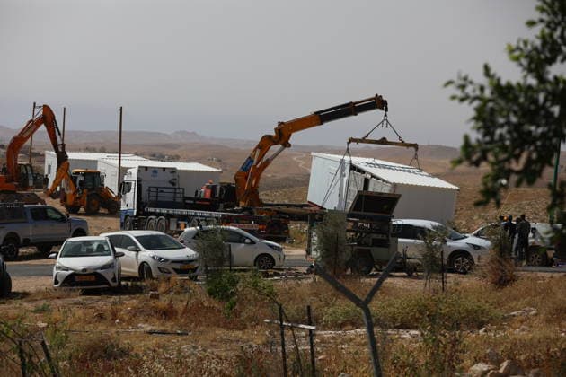 Illegal Israeli settlers expand outpost in West Bank s Umm al-Khair HEBRON, WEST BANK, PALESTINE - MAY 20: Prefabricated houses installed by illegal Israeli settlers are seen under the protection of the Israeli army in the village of Umm al-Khair, located in the Masafer Yatta region south of Hebron in West Bank, Palestine on May 20, 2026. Illegal settlers continue to expand a newly established settlement outpost, seizing Palestinian lands in the area. Wisam Hashlamoun Anadolu Hebron West Bank. Editorial use only. Please get in touch for any other usage.  Copyright: x2026xAnadoluxWisamxHashlamounx
