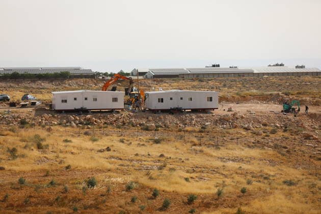Illegal Israeli settlers expand outpost in West Bank s Umm al-Khair HEBRON, WEST BANK, PALESTINE - MAY 20: Prefabricated houses installed by illegal Israeli settlers are seen under the protection of the Israeli army in the village of Umm al-Khair, located in the Masafer Yatta region south of Hebron in West Bank, Palestine on May 20, 2026. Illegal settlers continue to expand a newly established settlement outpost, seizing Palestinian lands in the area. Wisam Hashlamoun Anadolu Hebron West Bank. Editorial use only. Please get in touch for any other usage.  Copyright: x2026xAnadoluxWisamxHashlamounx