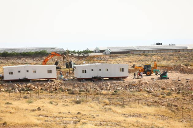 Illegal Israeli settlers expand outpost in West Bank s Umm al-Khair HEBRON, WEST BANK, PALESTINE - MAY 20: Prefabricated houses installed by illegal Israeli settlers are seen under the protection of the Israeli army in the village of Umm al-Khair, located in the Masafer Yatta region south of Hebron in West Bank, Palestine on May 20, 2026. Illegal settlers continue to expand a newly established settlement outpost, seizing Palestinian lands in the area. Wisam Hashlamoun Anadolu Hebron West Bank. Editorial use only. Please get in touch for any other usage.  Copyright: x2026xAnadoluxWisamxHashlamounx