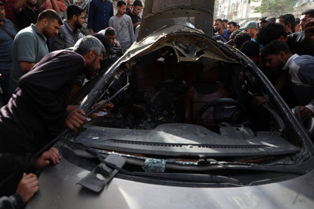 Palestinians Gather at Site of Israeli Strike in Gaza City others. May 20, 2026: Palestinians Gather at Site of Israeli Strike in Gaza City Palestinians gather at the site of an Israeli airstrike that targeted a vehicle on al-Shuhada Street in Gaza City, on May 19, 2026. According to local sources, the strike killed one person and wounded several others. Copyright: xx